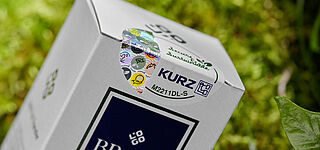 Add more sustainability to your product easily: TRUSTCONCPT® security labels Detail of sustainable security label on white packaging